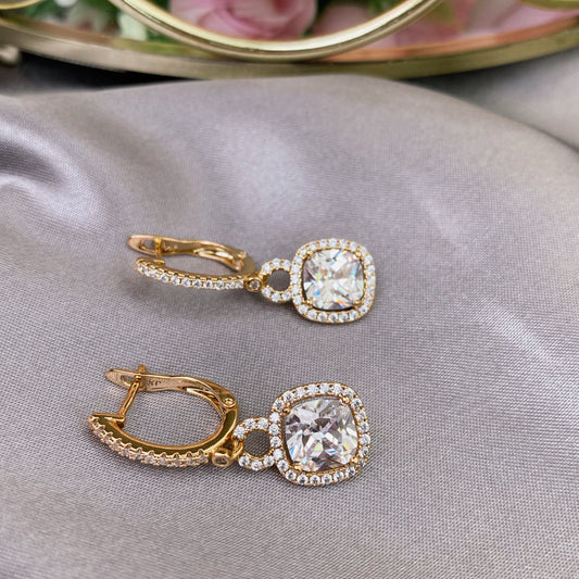 Gold plated earrings with white decorative crystal